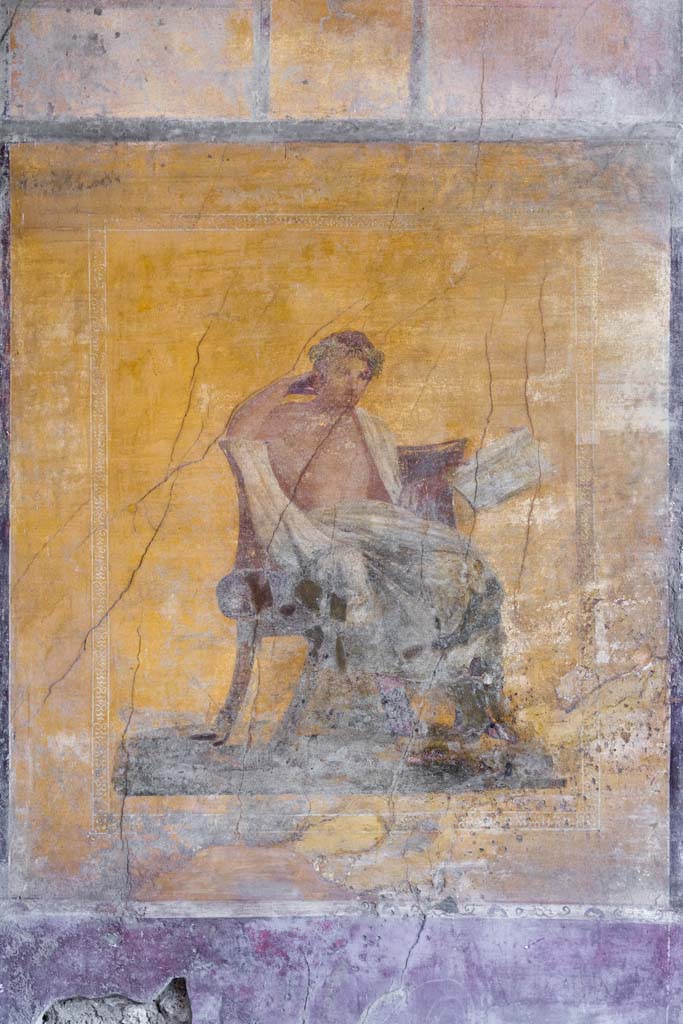 I.10.4 Pompeii. April 2022.
Alcove 23, wall painting of poet on west wall of alcove. Photo courtesy of Johannes Eber.