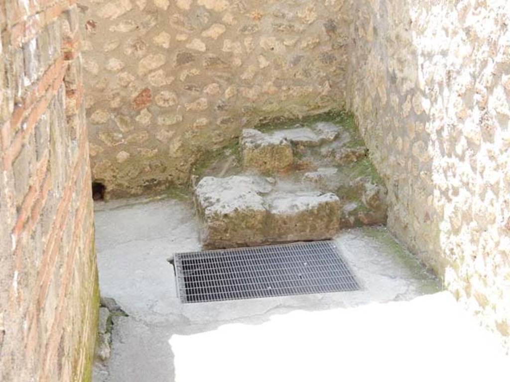 I.10.4 Pompeii. May 2015. Passageway P1, leading to services area from south-east corner of portico. Looking south. Photo courtesy of Buzz Ferebee.