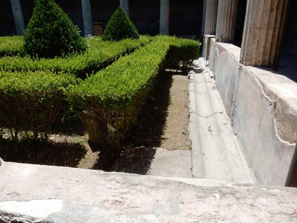 I.10.4 Pompeii. May 2017. Looking west across gutter on north side of peristyle garden from east portico. Photo courtesy of Buzz Ferebee.