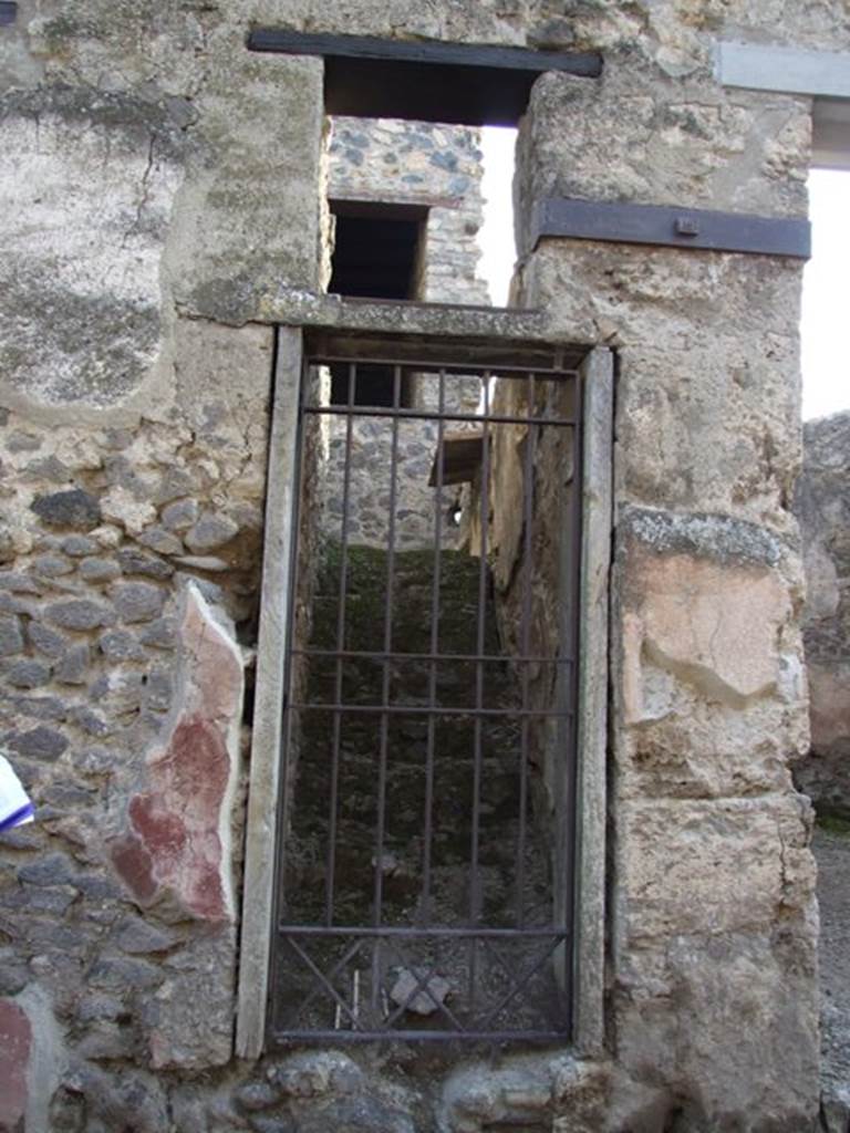 I.10.5 Pompeii. December 2007. Stairs to upper floor.
11 masonry steps leading to a small independent apartment.
Red painted plaster on exterior wall on east side of doorway.