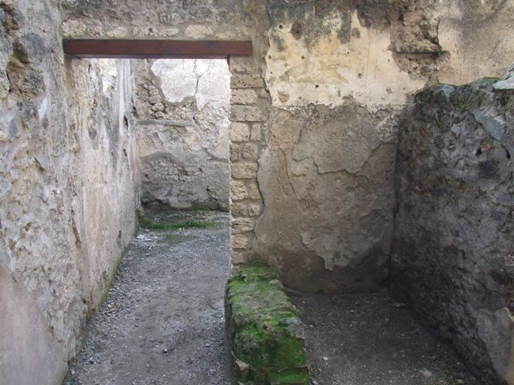 I.10.6 Pompeii. Workshop. December 2007. Small room to east of workshop, west wall and door to workshop.