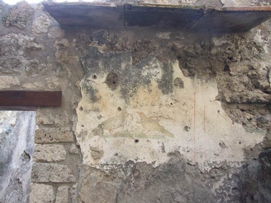 I.10.6 Pompeii. Workshop. December 2007. Small room to east of workshop. Wall painting of birds on west wall.