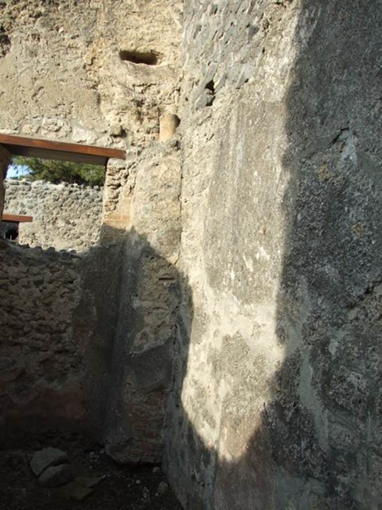 I.10.6 Pompeii. Workshop. December 2007. Small room to east of workshop. East wall, with waste pipe from upper level.