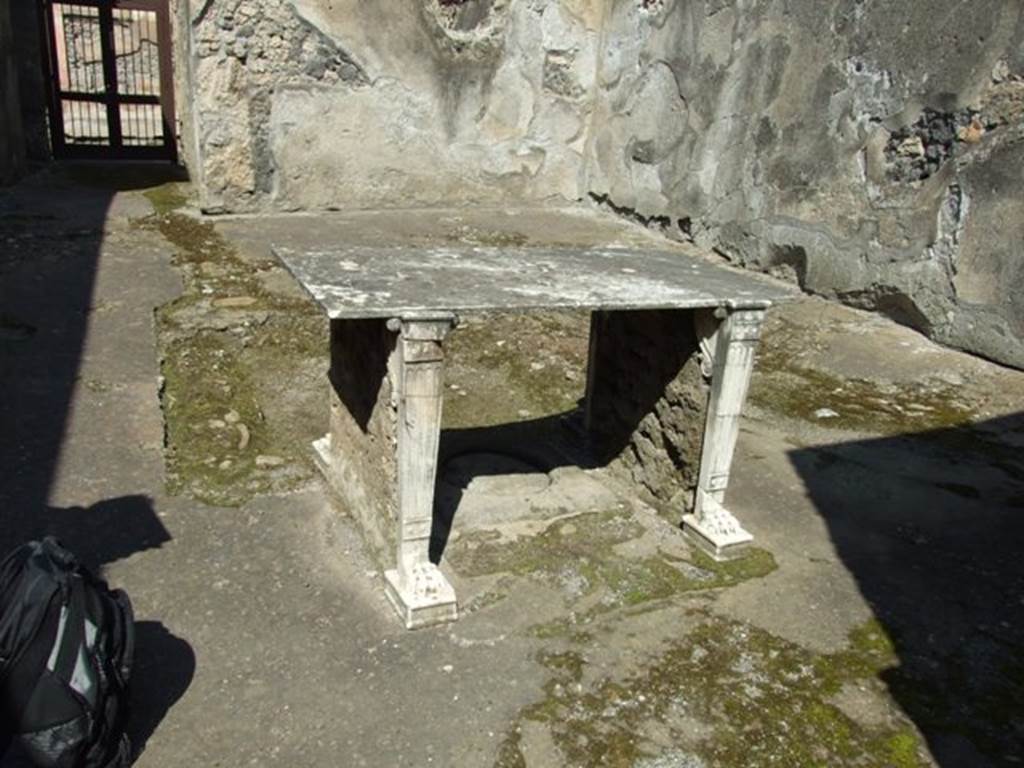 I.10.7 Pompeii. March 2009. Room 4, looking north in atrium, with table.