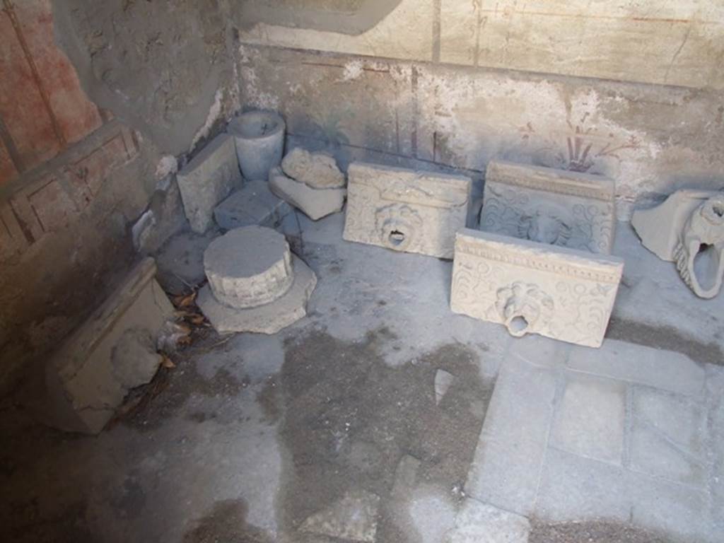 I.10.7 Pompeii. March 2009.  Room 3.  Cubiculum. South west corner.  Collection of Grondaia or antefisse fittili  (rainwater spouts for gutters).