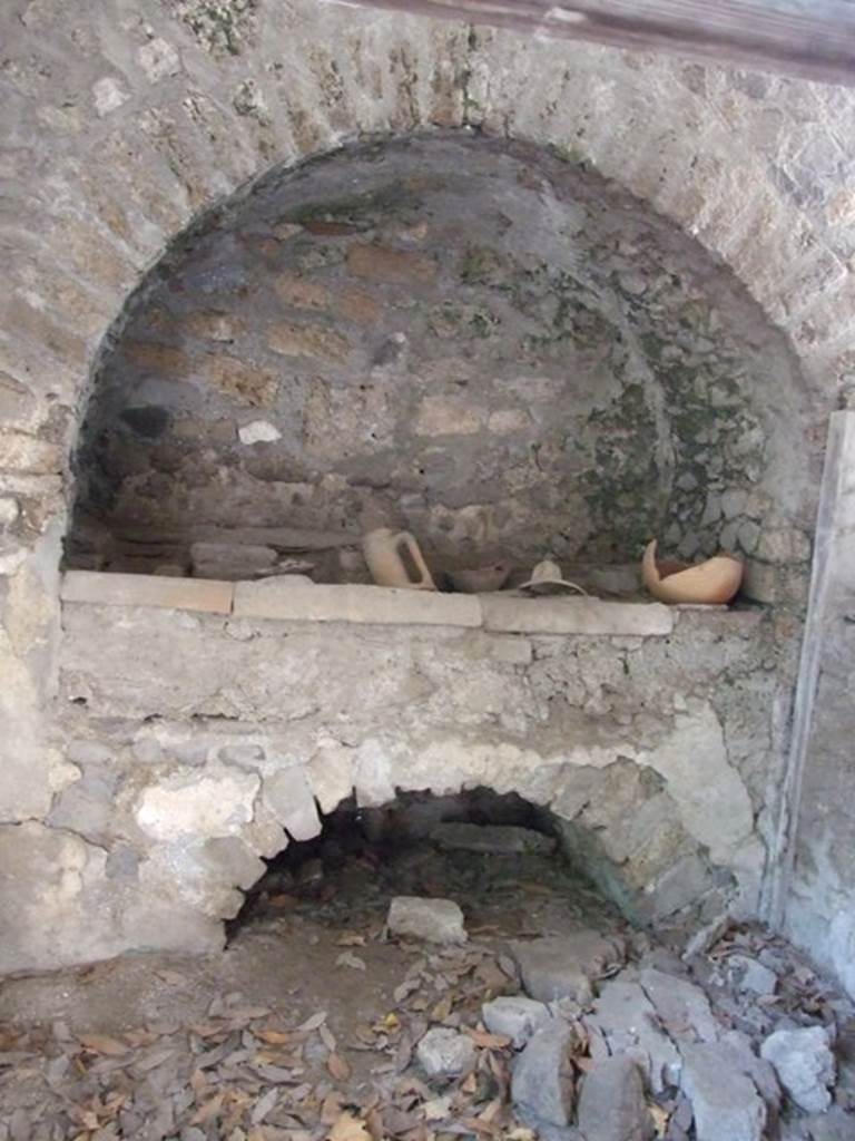 I.10.7 Pompeii. March 2009.  Room 9.  Hearth against west wall.