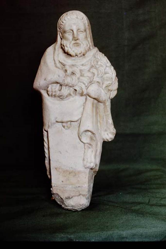 I.10.7 Pompeii. 1978. Room 11, marble statuette of Hercules. Photo by Stanley A. Jashemski.   
Source: The Wilhelmina and Stanley A. Jashemski archive in the University of Maryland Library, Special Collections (See collection page) and made available under the Creative Commons Attribution-Non Commercial License v.4. See Licence and use details. J78f0165
