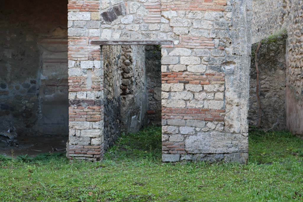 I.10.8 Pompeii. December 2018.
South side of atrium, with doorways to room 6 on left, room 7 the corridor, and room 8, on right. Photo courtesy of Aude Durand.