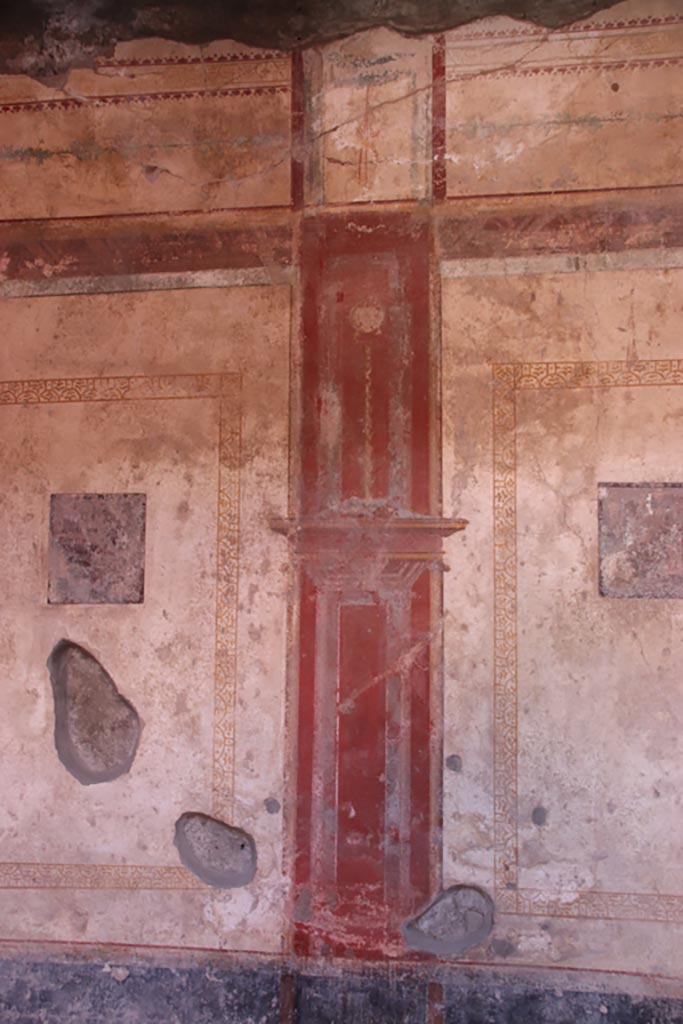 I.10.11 Pompeii. October 2022.
Room 6, central red compartment on the south wall. Photo courtesy of Klaus Heese.