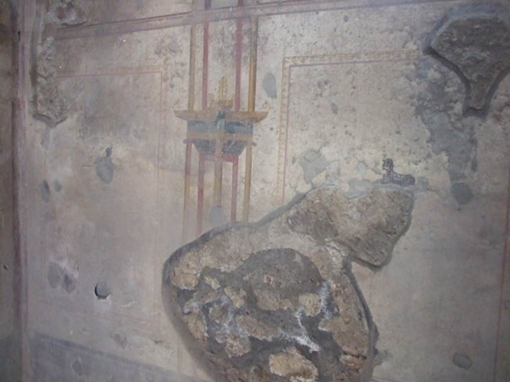 I.10.11 Pompeii. March 2009. Room 7, south wall of cubiculum with a painting of a sphinx in both side panels.
Also, in the north wall, on both west and east sides of the doorway, a painted sphinx is also seen.
On the west wall, not photographed, there were also small painted panels; at the south end were painted ducks among rushes, and at the north end was another painted crocodile.
According to PPM –
In room 7, there was a simple decoration painted on a white background with other architectural views and small panels of sphinxes and crocodiles or ducks among rushes.
See Carratelli, G. P., 1990-2003. Pompei: Pitture e Mosaici. II. (2). Roma: Istituto della enciclopedia italiana, (p.469).