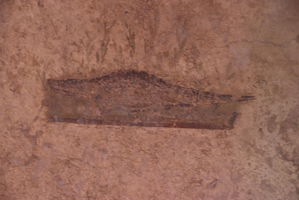 I.10.11 Pompeii. October 2022.
Room 7, painting of a crocodile from the north end of the west wall of cubiculum. Photo courtesy of Klaus Heese.