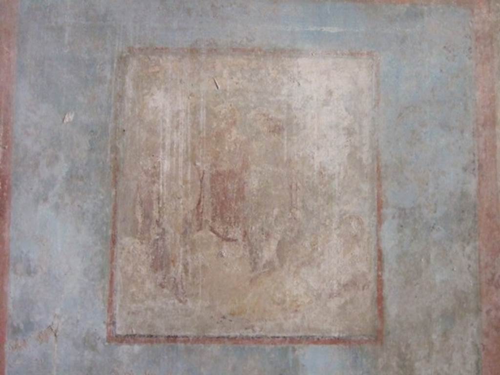 I.10.11 Pompeii. March 2009. Room 8, remains of central wall painting of Ariadne and Dionysus, from south wall of triclinium.
See Bragantini, de Vos, Badoni, 1981. Pitture e Pavimenti di Pompei, Parte 1. Rome: ICCD. (p.143).
Kuivalainen describes –
“A composition of at least five figures. In the right corner foreground is a reclining female with her face towards the viewer; her yellow cloak covers her legs and is lifted by a cupid, who stands behind her. In the middle, a standing youth watches the sleeping female. Next to him stand two others, one wearing a red cloak down to the hips.”
Kuivalainen comments –
“The foremost figure in the middle is Bacchus, and the one in the red cloak is Silenus. The pictorial programme of the room may concentrate on abandoned lovers, even if a better destiny awaits Ariadne.”
See Kuivalainen, I., 2021. The Portrayal of Pompeian Bacchus. Commentationes Humanarum Litterarum 140. Helsinki: Finnish Society of Sciences and Letters, (p.147, E8).
