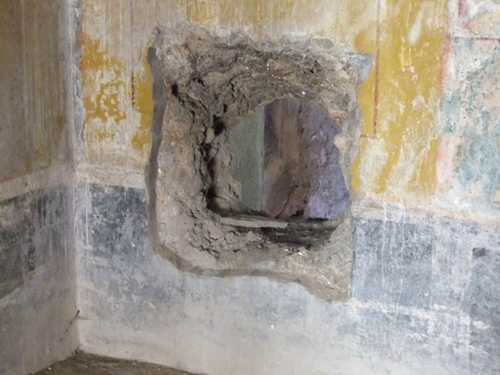 I.10.11 Pompeii. March 2009. Room 8. Triclinium. West wall. Ancient hole in wall.