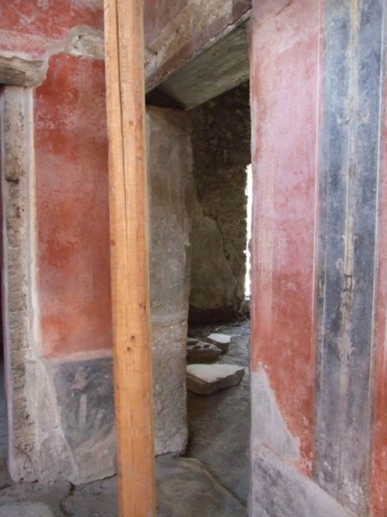 I.10.11 Pompeii. March 2009.
Room 2, doorway to linked shop at I.10.10 in north wall in north-west corner of atrium.