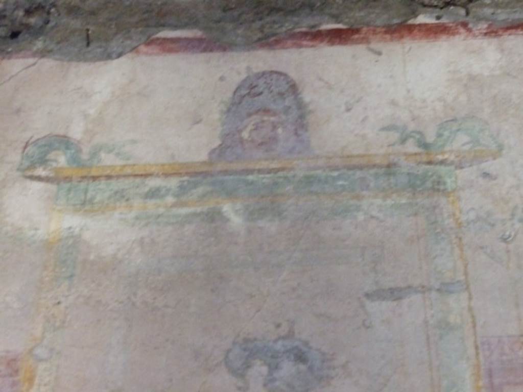 I.10.11 Pompeii. March 2009. Room 9, painting of mask and dolphins from west wall of cubiculum. See Bragantini, de Vos, Badoni, 1981. Pitture e Pavimenti di Pompei, Parte 1. Rome: ICCD. (p.141).