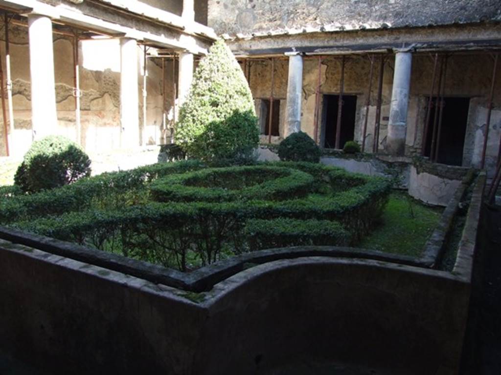 I.10.11 Pompeii. March 2009. Room 10, looking east across peristyle garden. The garden was enclosed by a low wall with a depression in the top for soil and plants. See Jashemski, W. F., 1993. The Gardens of Pompeii, Volume II: Appendices. New York: Caratzas. (p.50: T59).