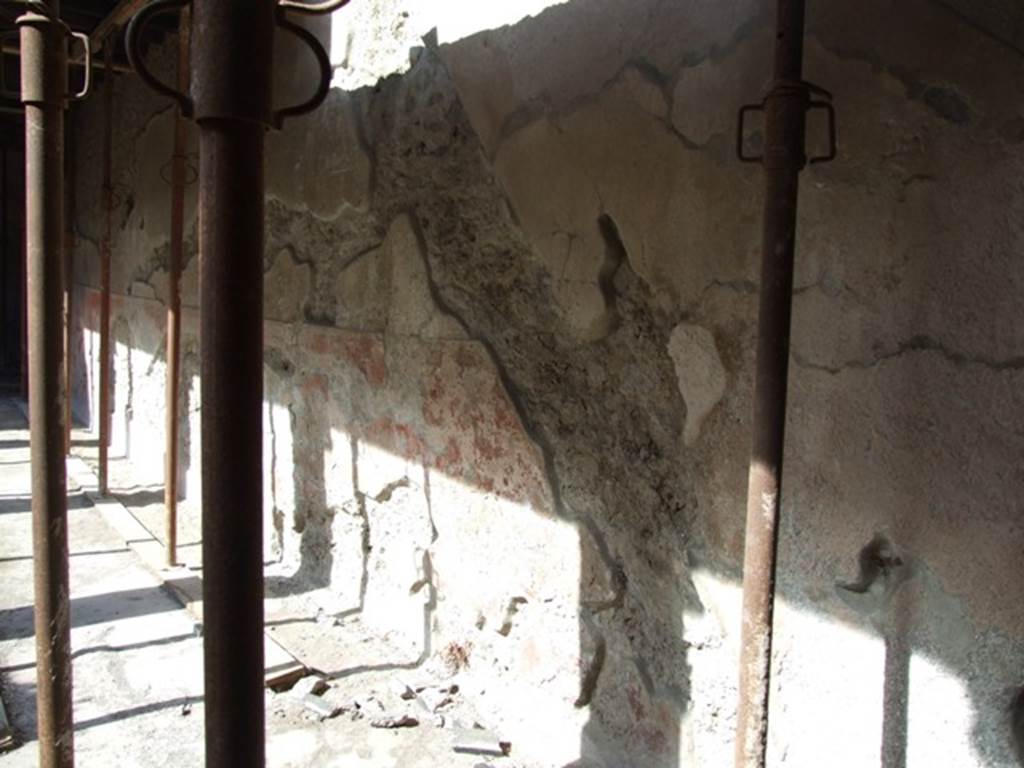 I.10.11 Pompeii. March 2009.
Room 10, looking west along north wall, showing outline of staircase to upper floor in plaster on north wall of peristyle.