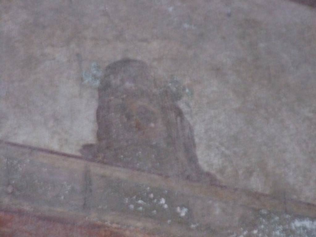 I.10.11 Pompeii. March 2009. Room 12. Cubiculum. North wall. Upper part. Painting of mask.