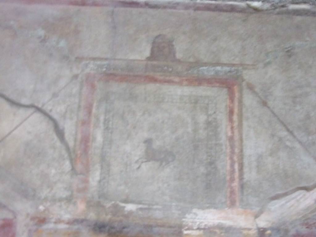 I.10.11 Pompeii. March 2009. Room 12. Cubiculum. North wall. Top of wall at centre. Painting of goat.
