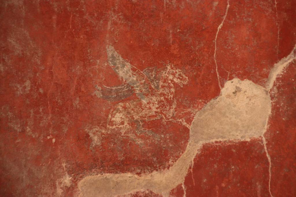 I.10.11 Pompeii. September 2021.
Room 12, painting of Pegasus from centre of panel at north end of east wall of cubiculum. Photo courtesy of Klaus Heese.