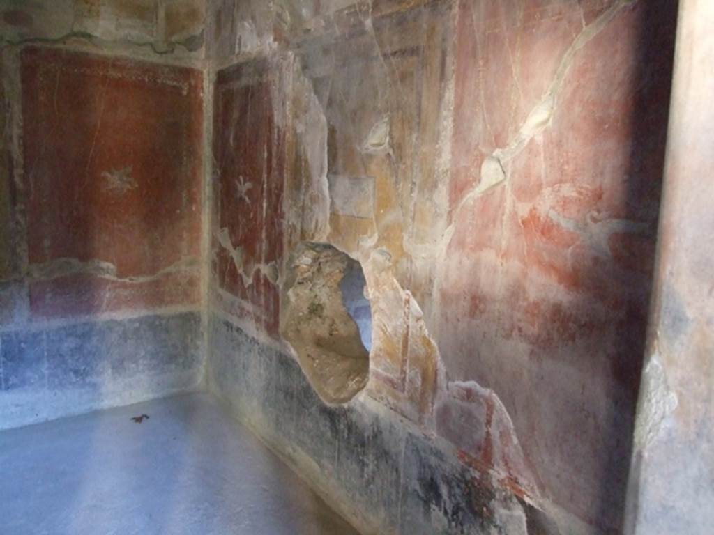 I.10.11 Pompeii. March 2009. Room 12. Cubiculum. South wall. Ancient hole in centre.