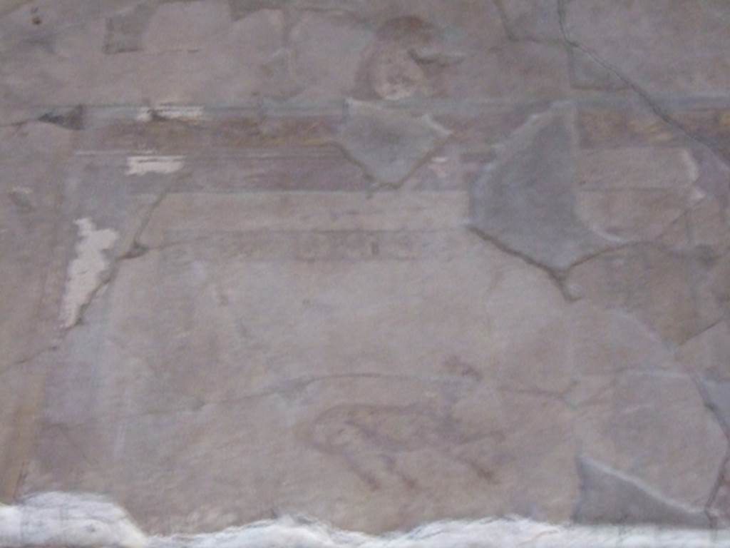 I.10.11 Pompeii. March 2009. Room 12. Cubiculum. West wall. Centre above door. Painting of a goat? and mask.