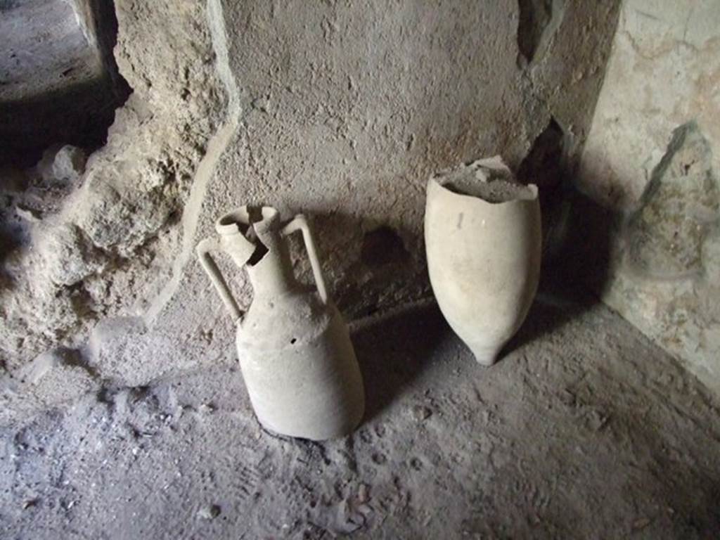 I.10.11 Pompeii. March 2009. Room 17. East wall. Remains of two amphorae.