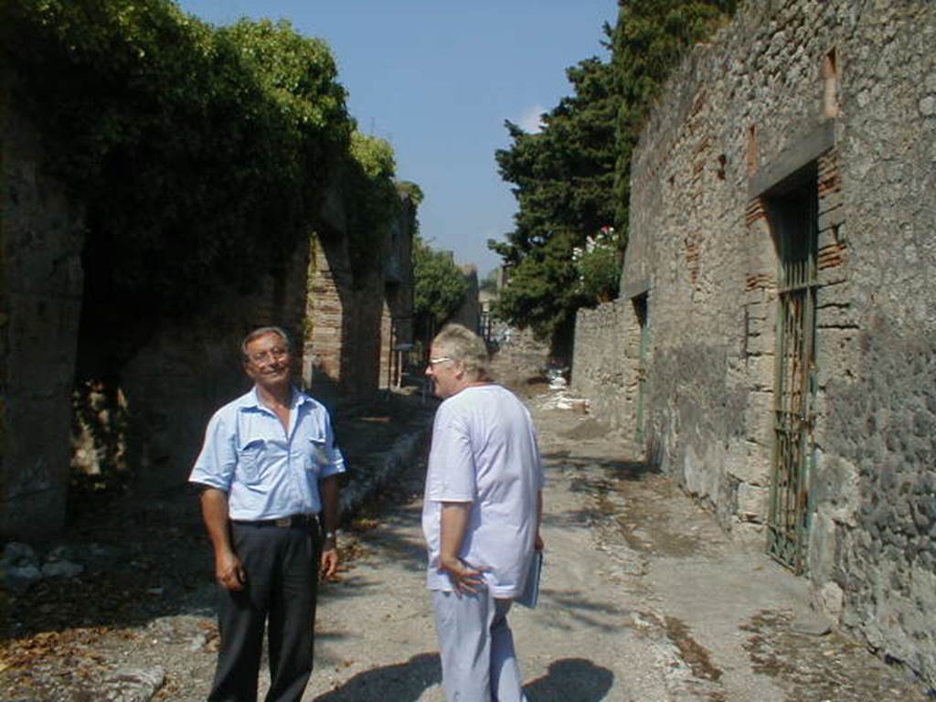 I.10.11 Pompeii. September 2004. Roadway outside the House of the Lovers looking north.