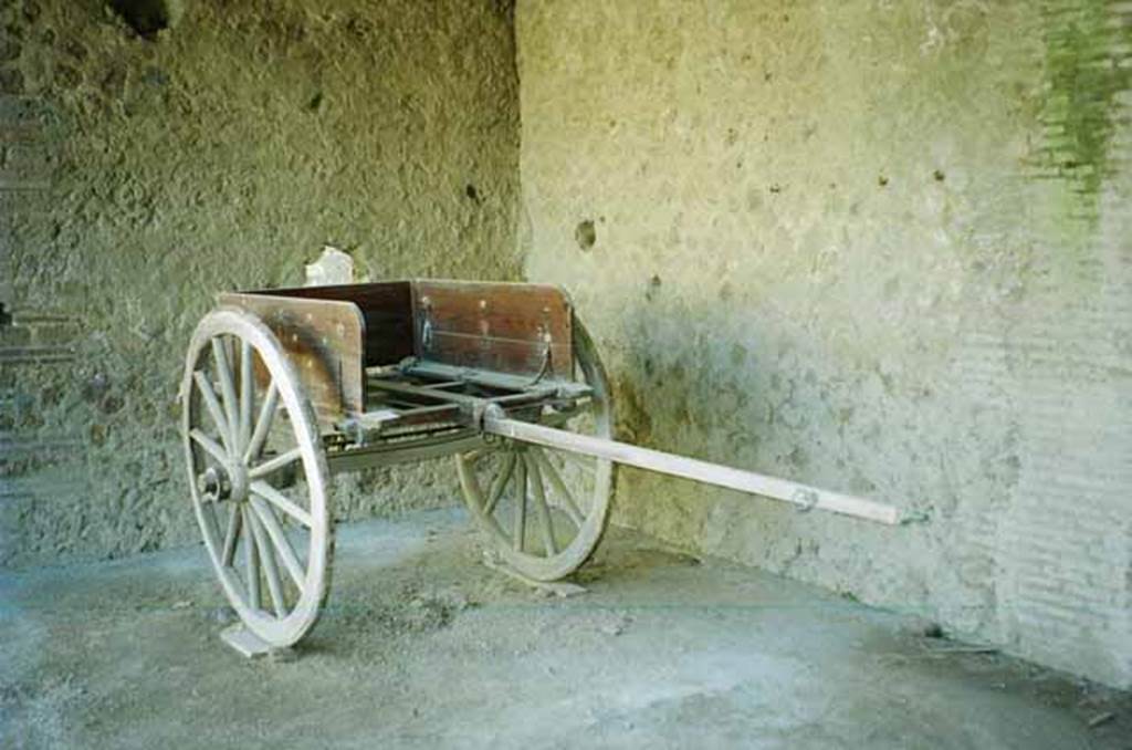 I.10.14 Pompeii. June 2010. Reproduction two-wheeled cart, with bronze fittings and iron fittings. Photo courtesy of Rick Bauer.