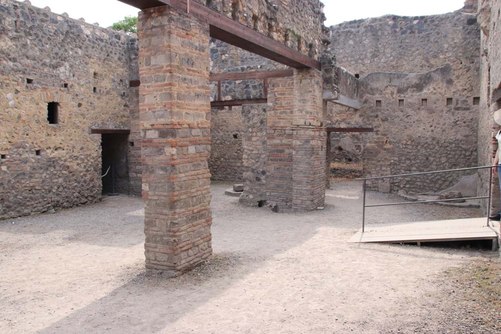 I.10.14 Pompeii. September 2021.
Looking towards south-west corner and west wall, with doorway in north wall, on right. Photo courtesy of Klaus Heese.