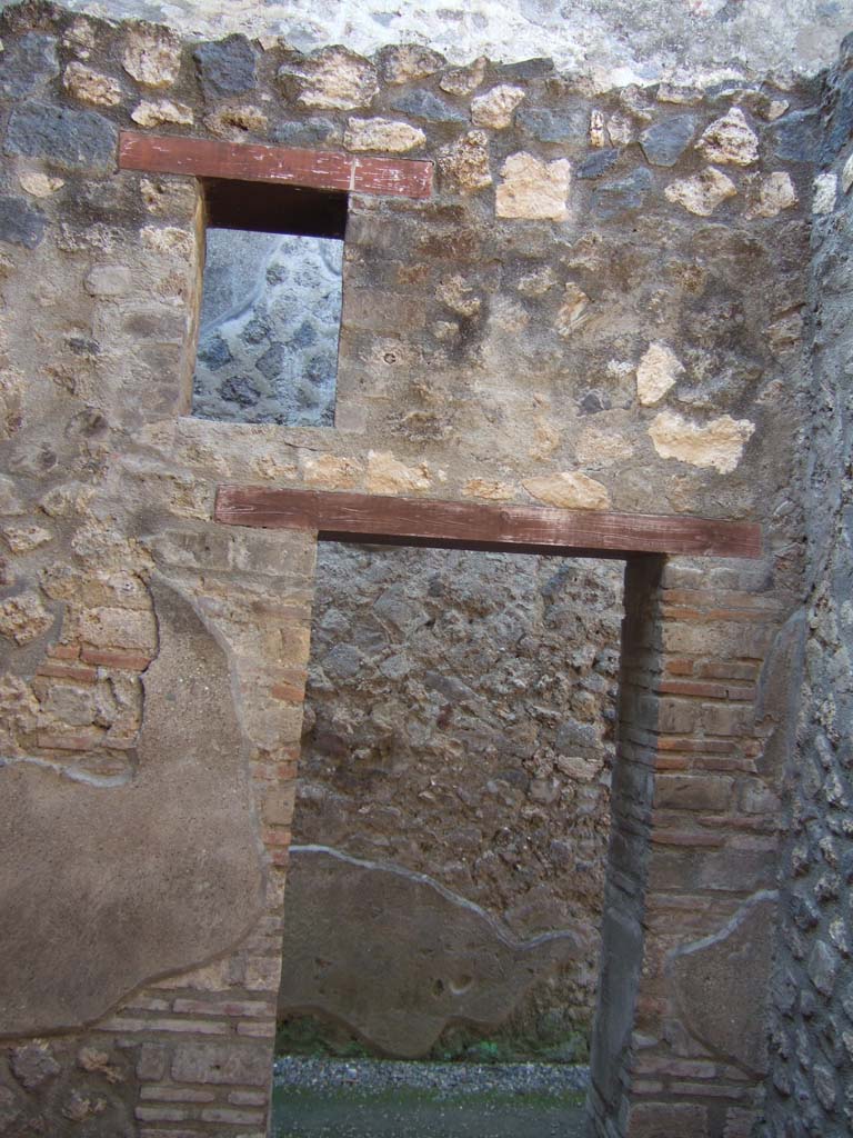 I.10.15 Pompeii. September 2005. Entrance room. West wall with doorway to rear corridor.