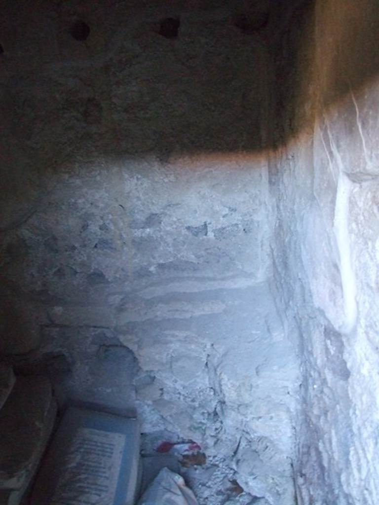 I.10.16 Pompeii. March 2009. Looking south across part of L-shaped Kitchen, the part facing west. Remains of masonry platform or hearth.