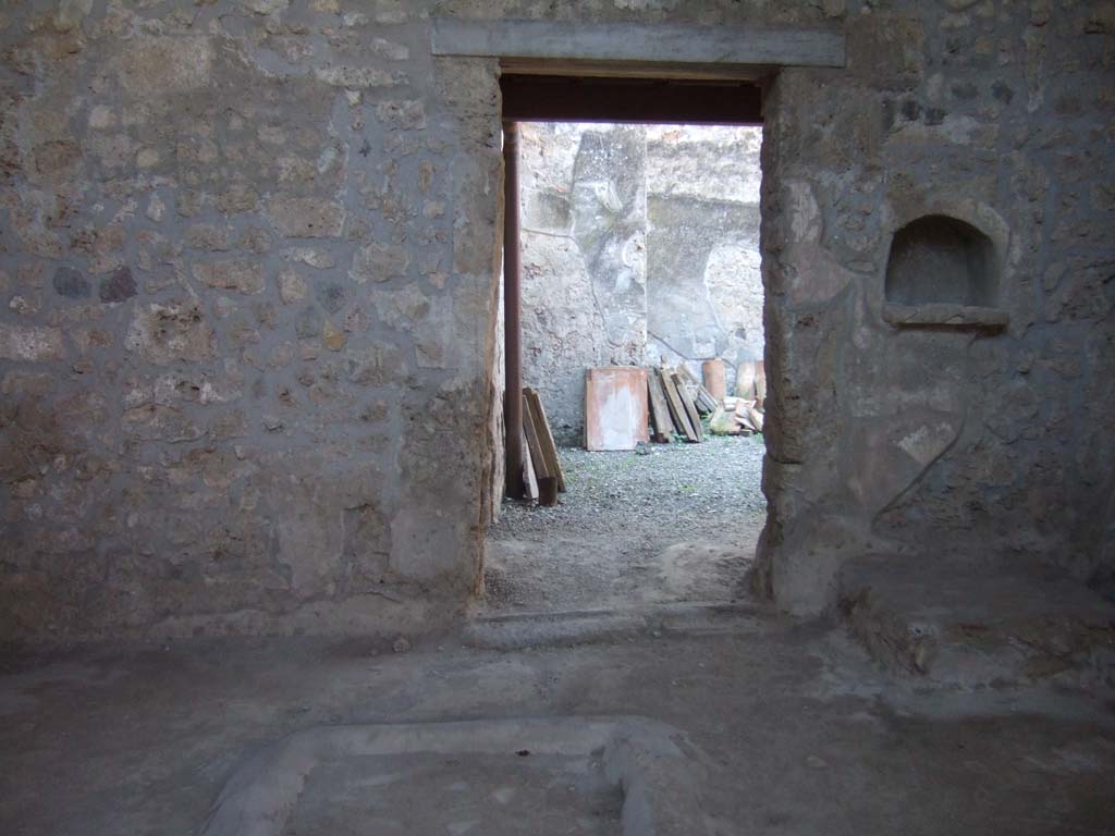 I.10.16 Pompeii. September 2005. Atrium, west side with doorway to garden.