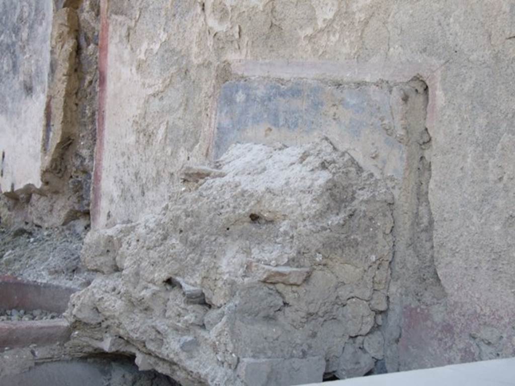 I.11.1 Pompeii. Caupona. West side. Remains of shelves for displaying drinking vessels.