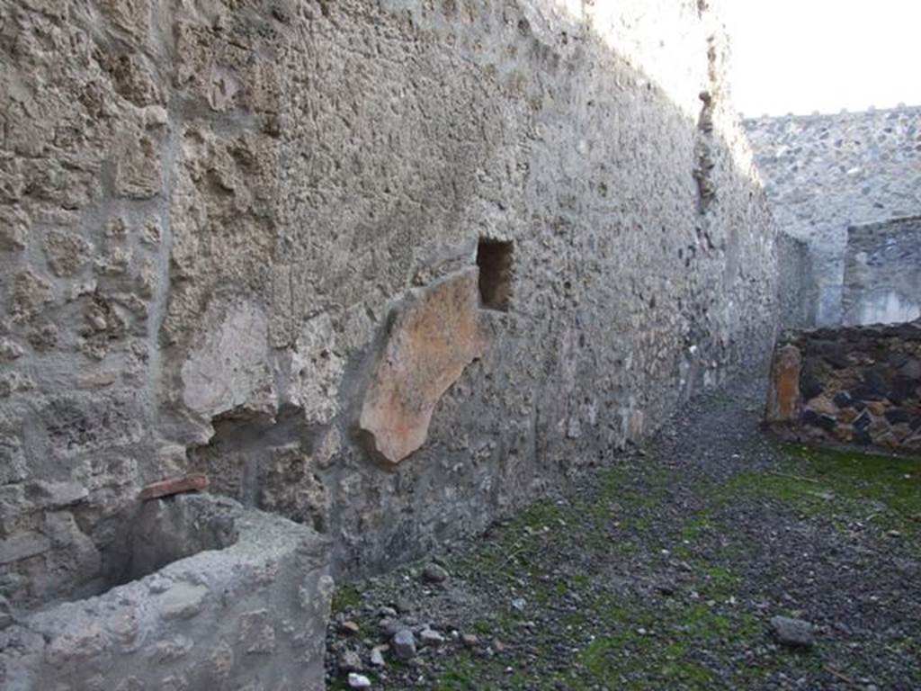 I.11.2 Pompeii. Shop. East wall.