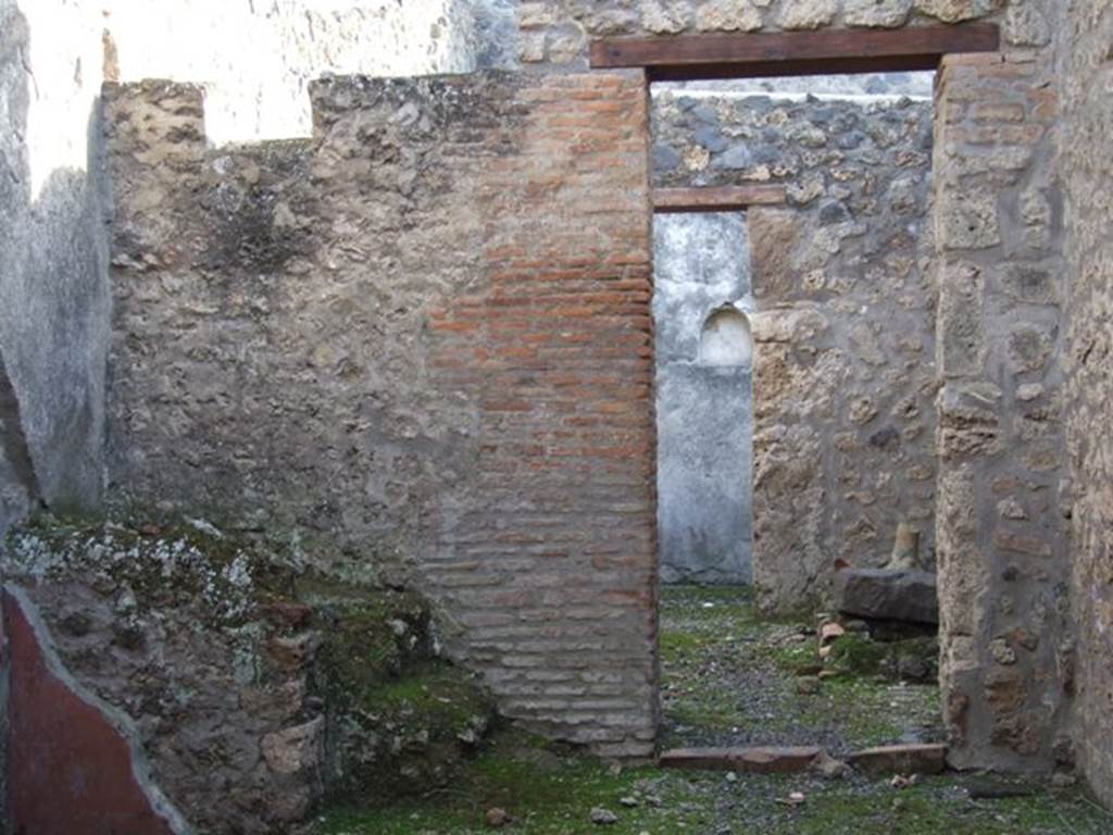 I.11.3 Pompeii. December 2007. South wall with door to kitchen and rear door leading to garden.