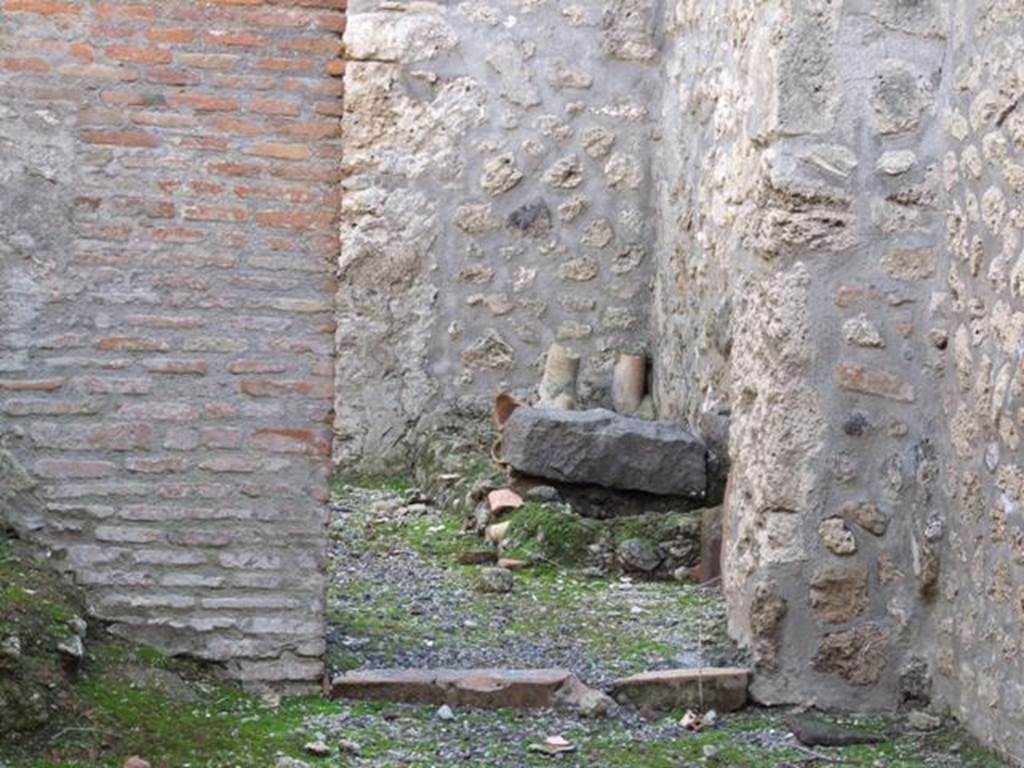 I.11.3 Pompeii. December 2007. Kitchen doorway in south wall with remains of hearth.