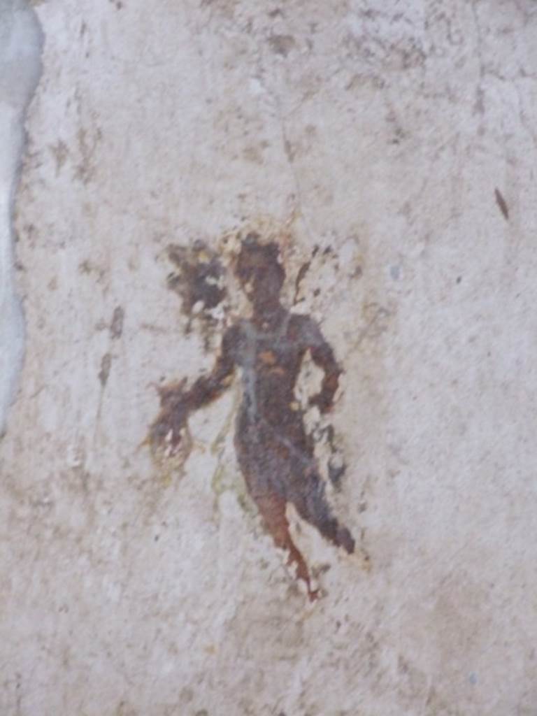 I.11.6 Pompeii. March 2009. Room 4, north of door on west wall.
Painting of flying figure of Mercury, who crosses the threshold with a sack full of money.
According to Mileti, in light of what has been said and the value of the various objects found, it can be hypothesised that the owner of the house owed his fortune to commerce, as the image of the god Mercury depicted walking through the door with a sack of money would also testify.
See Mileti, M. C., 2000. La casa I, 11, 6-7 a Pompeii: Rivista di Studi Pompeiani XI, p. 110, fig. 23.