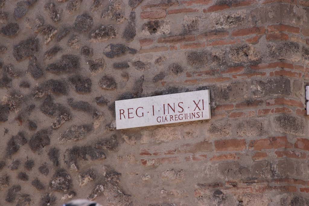 I.11.7 Pompeii, west side wall in Vicolo della Nave Europa. September 2019.
Insula identification plaque, Reg. I. Ins. X1, previously known as Reg. II, Ins. 1. Photo courtesy of Klaus Heese.