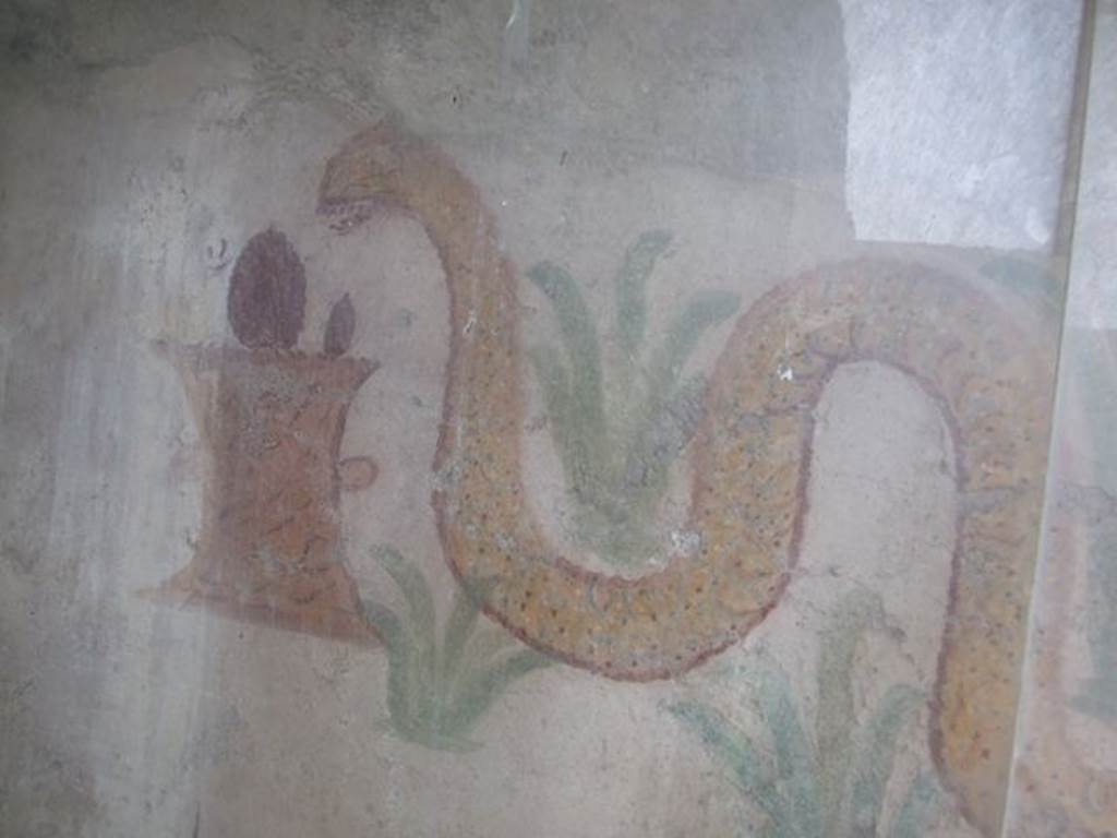 I.11.11 Pompeii. May 2006. Lararium. Detail of snake and altar.