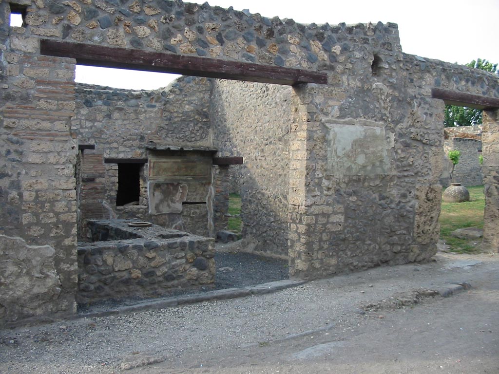 I.11.11 Pompeii, on left, and I.11.10, on right. May 2003.
Looking north-east towards entrance doorways. Photo courtesy of Nicolas Monteix.