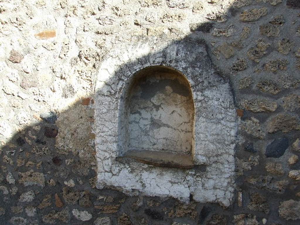 I.11.13 Pompeii. December 2006. Arched niche lararium on east wall.
The niche and surrounding wall panel were plastered and painted white.
See Giacobello, F., 2008. Larari Pompeiani: Iconografia e culto dei Lari in ambito domestico. Milano: LED Edizioni. (p.258)
