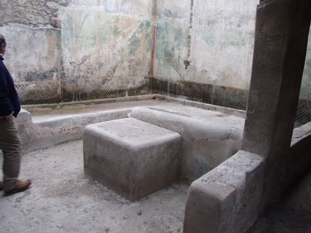 I.11.16 Pompeii. December 2007. Room 6, Looking north-east across triclinium.
On the right of the photo is the low wall (or pluteus) separating the outdoor triclinium from the passagway, room 9. According to Packer, the wall was 0.62m high. A heap of empty amphorae, stacked so that the mouths of those above enclosed the pointed end of those below, were found on the north-east corner of the triclinium, see Packer fig. 11 on page 21). Packer included the note: “This room was being excavated on July 21 1960, according to RDP. Some of the more important items found were: a fragmentary bronze patera, a broken bronze oinochoe with a trilobate mouth, three terracotta lamps and one of glass.
See Packer, J: Inns at Pompeii: a short survey, in Cronache Pompeiane IV-1978 (p.18-24, with note on page 21)