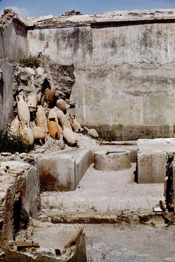 I.11.16 Pompeii. 1961. Looking towards north-east corner and heap of empty amphorae.
Photo by Stanley A. Jashemski.
Source: The Wilhelmina and Stanley A. Jashemski archive in the University of Maryland Library, Special Collections (See collection page) and made available under the Creative Commons Attribution-Non Commercial License v.4. See Licence and use details.
J61f0240