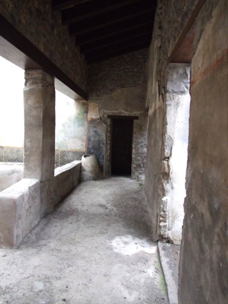 I.11.16 Pompeii. December 2007.
Room 9, looking east along corridor 9 on south side of triclinium, which gave access to rear rooms.
At the far end is a door leading to a small alcove, room 13, with the doorway to room 10 on its right.
On the extreme right is the doorway to room 8.
According to Packer’s note:
“Where they have restored lintels, the heights of the doors to these rooms are as follows: between rooms 9 and 10, 1.96m; that between rooms 9 and 13, 1.71m.”
See Packer, J: Inns at Pompeii: a short survey, in Cronache Pompeiane IV-1978 (p.18-24, with note on page 22).