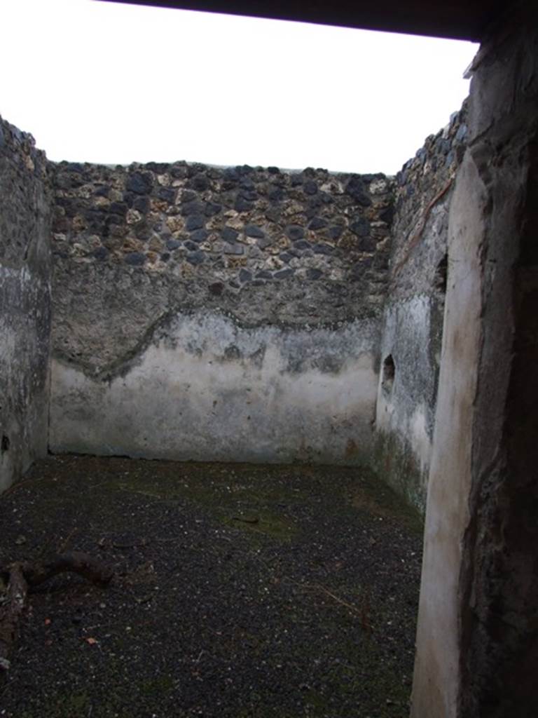 I.11.16 Pompeii. December 2007. Doorway to room 8, looking east. According to Packer, this may have been a winter triclinium or an oecus. The walls were painted with plain white stucco.