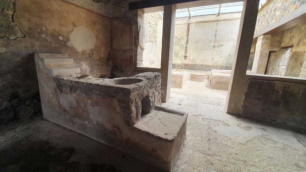 I.11.16 Pompeii. July 2021. Room 3, looking east from bar-counter with hearth towards room 6, triclinium.
Foto Annette Haug, ERC Grant 681269 DÉCOR.