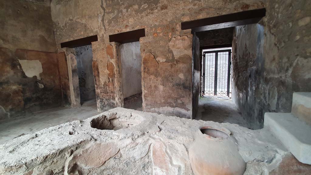 I.11.16 Pompeii. July 2021.
Looking south-west from bar-counter towards doorways to rooms 5, on left, 4, in centre, and entrance corridor/doorway, on right.
Foto Annette Haug, ERC Grant 681269 DÉCOR.