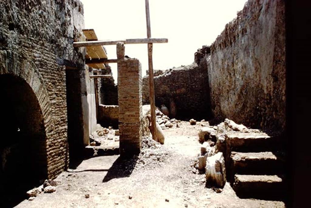 I.12.2 and I.12.1 Pompeii. 1961. Room 11, steps to upper floor, against west wall.
Looking south towards room 12. Photo by Stanley A. Jashemski.
Source: The Wilhelmina and Stanley A. Jashemski archive in the University of Maryland Library, Special Collections (See collection page) and made available under the Creative Commons Attribution-Non Commercial License v.4. See Licence and use details.
J61f0246