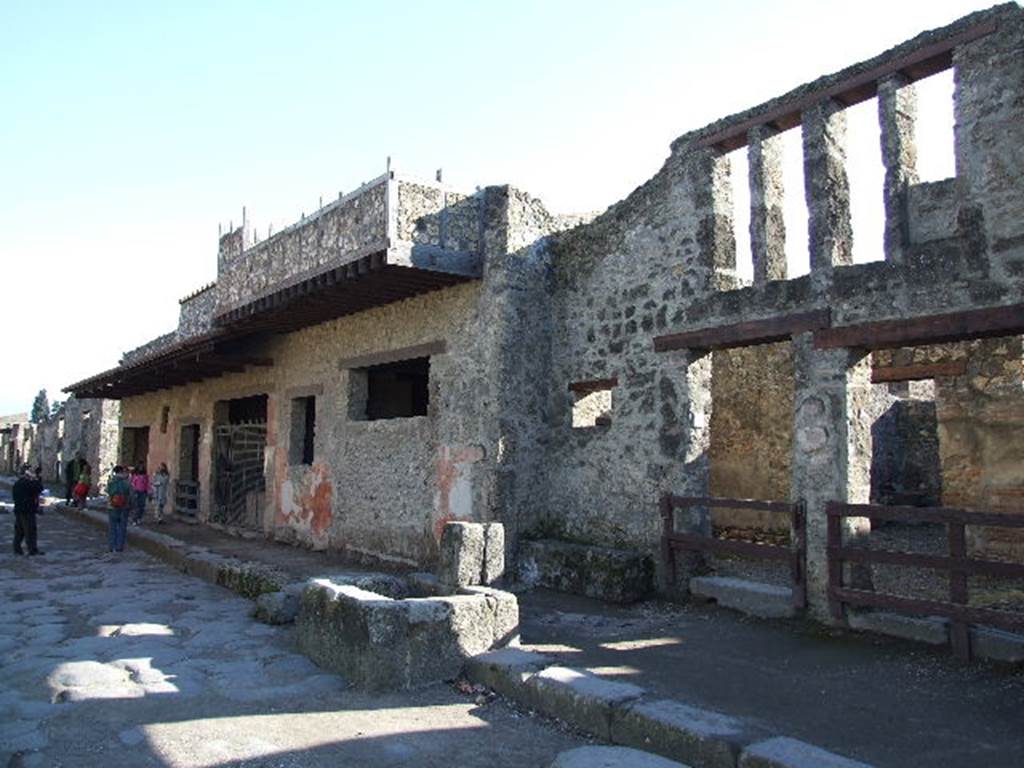 I.12.1 and I.12.2 Pompeii. December 2006. Entrances on Via dell’Abbondanza. Looking east.